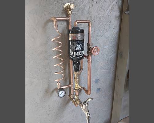 Wall mounted free pour dispenser